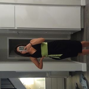 Black midi dress with a lime green band in the middle